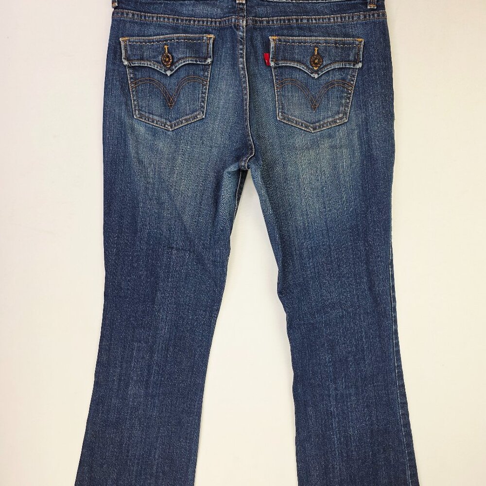 These Levi's Size 10 Women's 32 Inch Inseam 526 Slender Boot Cut Blue Denim Logo